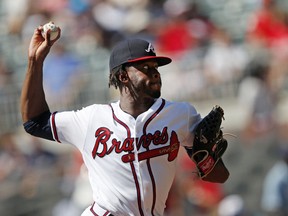 Atlanta Braves starting pitcher Touki Toussaint works against the St. Louis Cardinals in the first inning of a baseball game Wednesday, Sept. 19, 2018, in Atlanta.