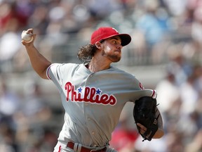 Philadelphia Phillies starting pitcher Aaron Nola works in the first inning against the Atlanta Braves in a baseball game Sunday, Sept. 23, 2018, in Atlanta.