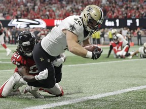 New Orleans Saints running back Zach Line (42) runs into the end zone for a touchdown against Atlanta Falcons defensive back Desmond Trufant (21) during the second half of an NFL football game, Sunday, Sept. 23, 2018, in Atlanta.