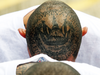 Tattooed MS-13 gang members at a maximum security prison in Zacatecoluca, El Salvador.