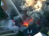 In this image take from video, flames consume the roof of a home in Lawrence, Mass, a suburb of Boston, Thursday, Sept. 13, 2018.