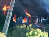 In this image take from video, flames burn through a home in Lawrence, Mass, a suburb of Boston, Thursday, Sept. 13, 2018.