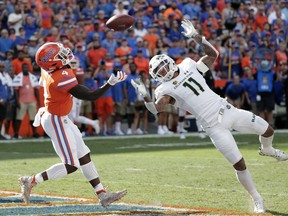 Colorado State safety Jordan Fogal (11) breaks up a pass intended for Florida running back Kadarius Toney (4) during the first half of an NCAA college football game, Saturday, Sept. 15, 2018, in Gainesville, Fla.