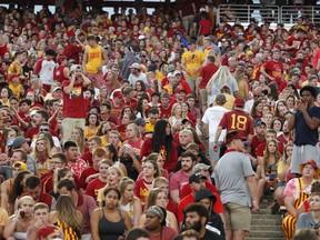 Fans are asked to leave the stadium after lightning was spotted during as Iowa State takes on South Dakota State in an NCAA college football game, Saturday, Sept. 1, 2018, in Ames, Iowa.