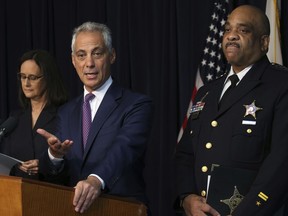 Chicago mayor Rahm Emanuel flanked by Chicago police Superintendent Eddie Johnson and Attorney General Lisa Madigan, announce that they have filed a proposed consent decree in federal court to reform the Chicago Police Department, during a news conference, Thursday, Sept. 13, 2918 in Chicago. The 226-page document was submitted Thursday to a Chicago federal judge.