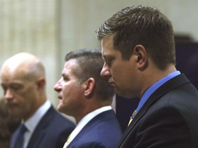 Chicago police Officer Jason Van Dyke, right, stands with attorneys during the third day of his murder trial for the 2014 killing of Laquan McDonald on Wednesday, Sept. 19, 2018, at the Leighton Criminal Court Building in Chicago.