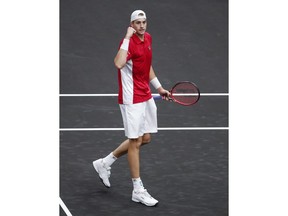 Team World's John Isner reacts after scoring a point against Team Europe's Alexander Zverev at the Laver Cup tennis event, Saturday, Sept. 22, 2018, in Chicago.