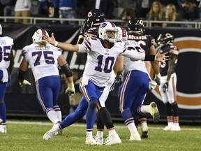 Buffalo Bills quarterback AJ McCarron (10) celebrates a game-winning touchdown throw against the Chicago Bears during the second half of an NFL preseason football game in Chicago, Thursday, Aug. 30, 2018.