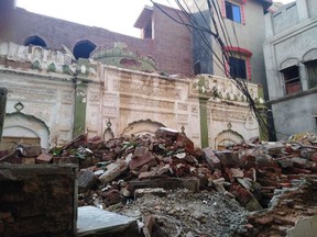 In this Thursday, Sept. 27, 2018 photo, debris remains from an Ahmadi mosque that was demolished by an angry mob on May, 24, 2018, in the eastern city of Sialkot, Pakistan. The embattled Ahmadiyya minority enjoyed a brief moment of hope in September when one of their own, a U.S.-based Princeton economist, was appointed to an economic advisory council. But the backlash from Islamic hard-liners, which led newly elected Prime Minister Imran Khan to quickly rescind the appointment under political pressure, has only underscored the Ahmadis' fraught position in the conservative, Muslim-majority country.