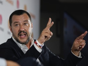 Matteo Salvini answers questions during an interview, in Milan, Italy, Monday, Sept. 10, 2018.