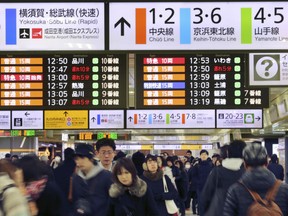 In this photo taken Jan. 14. 2017, people walk around at Tokyo Station in Tokyo. Tourism to Japan is booming, with 1 million Americans among the country's more than 20 million annual visitors. But language barriers and cultural differences may seem intimidating to some travelers.