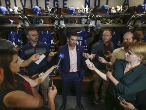 The Toronto Maple Leafs’ John Tavares speaks to the media at his locker after signing on for a seven-year, $77 million contract on Sunday July 1, 2018.