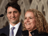 Prime Minister Justin Trudeau looks on as former astronaut and Governor General designate Julie Payette talks to reporters in Ottawa in July 2017.