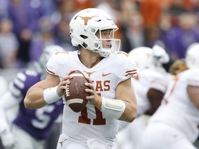 Texas quarterback Sam Ehlinger (11) looks downfield during the first quarter of a college football game against Kansas State in Manhattan, Kan., Saturday, Sept. 29, 2018.