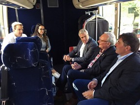 New Brunswick Liberal Leader Brian Gallant, left, and his wife Karine Lavoie are joined on the campaign bus by Newfoundland and Labrador Premier Dwight Ball, Prince Edward Island Premier Wade MacLauchlan and Intergovernmental Affairs minister Dominic LeBlanc in Moncton, N.B. on Sunday, Sept. 23, 2018.THE CANADIAN PRESS/Kevin Bissett