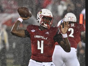 Louisville quarterback Jason Pass (4) throws a pass during the first half of the team's NCAA college football game against Indiana State, Saturday, Sept. 8, 2018, in Louisville, Ky.