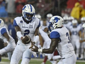 Indiana State quarterback Jalil Kilpatrick (2) hands the ball off to Indiana State running back Ja'Quan Keys (3) during the first half of an NCAA college football game against Louisville, Saturday, Sept. 8, 2018, in Louisville, Ky.