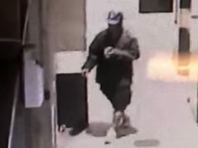 FILE - This undated file photo from surveillance video provided by the Los Angele Police Department shows a man they are seeking in connection with the assault on three homeless men who were brutally beaten with a baseball bat in Los Angeles early Sunday, Sept. 16, 2018. Two of those men have died. Authorities on Monday, Sept. 24, arrested a man on suspicion of bludgeoning a homeless man in Santa Monica, Calif., earlier Monday. He is now being investigated in connection with at least six attacks in both cities that have left three dead. (Los Angeles Police Department via AP, File)