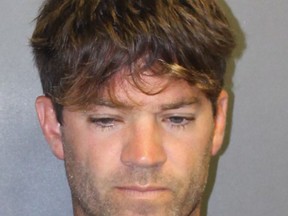 This undated booking photo provided by the Newport Beach, Calif., Police Department shows Grant W. Robicheaux, 38, a California doctor who appeared in a reality TV dating show. He and a woman co-defendant, Cerissa Laura Riley, 31, have been charged with drugging and sexually assaulting two women, and authorities suspect there may be many more victims. Orange County District Attorney Tony Rackauckas announced charges Tuesday, Sept. 18, 2018 against Robicheaux of Newport Beach and Riley of Brea. (Newport Beach Police Department via AP)