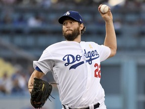Los Angeles Dodgers pitcher Clayton Kershaw throws to the plate during the first inning of a baseball game against the Arizona Diamondbacks, Saturday, Sept. 1, 2018, in Los Angeles.