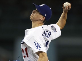 Los Angeles Dodgers starting pitcher Walker Buehler throws against the Colorado Rockies during the first inning of a baseball game, Wednesday, Sept. 19, 2018, in Los Angeles.