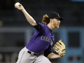 Colorado Rockies starting pitcher Jon Gray delivers to a Los Angeles Dodgers batter during the first inning of a baseball game in Los Angeles, Monday, Sept. 17, 2018.