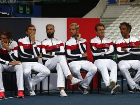 French team with captain Yannick Noah, right, Lucas Pouille, second right, Richard Gasquet, third right, Benois Paire, third left, Julien Benneteau, second left, and Nicolas Mahut attends the Davis Cup draw, Thursday, Sept.13, 2018 in Lille, northern France. France will play Spain from Friday to Sunday in the Davis Cup semifinal.