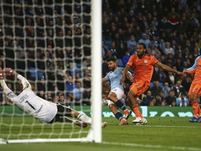 Manchester City's Sergio Aguero fails to score during the Champions League Group F soccer match between Manchester City and Lyon at the Etihad stadium in Manchester, England, Wednesday, Sept. 19, 2018.