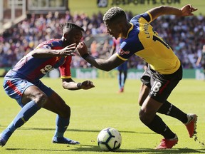 Crystal Palace's Aaron Wan-Bissaka, left and Southampton's Mario Lemina battle for the ball during their English Premier League soccer match at Selhurst Park, London, Saturday, Sept. 1, 2018.