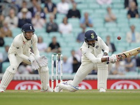 India's K. L. Rahul hits a four behind during the fifth cricket test match of a five match series between England and India at the Oval cricket ground in London, Tuesday, Sept. 11, 2018.