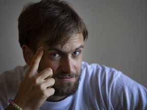 FILE  - In this file photo taken dated Friday, Sept. 7, 2018, Pyotr Verzilov, a member of the feminist protest group Pussy Riot speaks during an interview to the Associated Press in Moscow, Russia. Of the four people who protested on the field during the World Cup soccer final in Moscow, one is now in intensive care and another spent part of the week in a jail cell.  On Wednesday, Sept. 12, 2018 five days after speaking to the AP, Verzilov was admitted to the intensive care ward of a Moscow hospital.