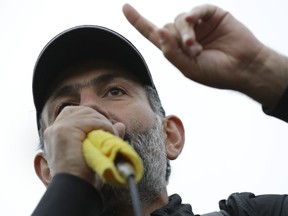 FILE - In this file photo dated Saturday, April 28, 2018, Opposition leader Nikol Pashinian speaks to a crowd in Vanadzor, Armenia, as candidate for prime minister.  Defense lawyer Aik Alumian said Friday Sept. 14, 2018, that a wiretapped conversation shows that law enforcement chiefs discussed taking action against former president Robert Kocharian and mentioned Prime Minister Nikola Pashinian's order to put the ex-president behind bars.