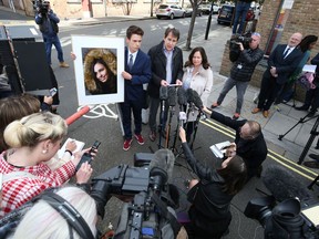 Nadim and Tanya Ednan-Laperouse, with their son Alex, speaking to the media outside West London Coroners Court, Friday Sept. 28, 2018, following the inquest into the death of Natasha Ednan-Laperouse, 15, seen on poster, who died after suffering a fatal allergic reaction on a flight from London to Nice after eating a Pret A Manger sandwich at Heathrow Airport.  Natasha's father, Nadim, said Friday he hoped the death of their daughter could serve as a watershed moment to make meaningful changes to allergy labelling on food packaging.