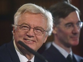 British lawmakers David Davis, left, and Jacob Rees-Mogg, right, at the launch of the Institute of Economic Affairs' Brexit research paper, in central London, Monday Sept.  24, 2018. The IEA unveils its own projected framework for post Brexit trade relationships between the United Kingdom, the European Union, and the rest of the world.
