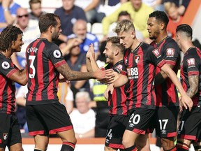 Bournemouth's Ryan Fraser, centre right,  celebrates with teammates after scoring his side's first goal of the game during the English Premier League soccer match between Bournemouth and Leicester City at the Vitality Stadium, in Bournemouth, England, Saturday, Sept.  15, 2018.