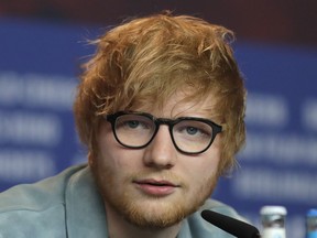 In this file photo dated Friday, Feb. 23, 2018, singer-songwriter Ed Sheeran speaks during a press conference in Berlin, Germany.