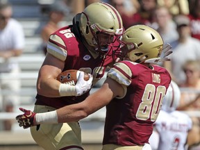 Boston College tight end Ray Marten (86) celebrates his touchdown with Hunter Long (80) during an NCAA college football game against Massachusetts, Saturday, Sept. 1, 2018 in Boston.