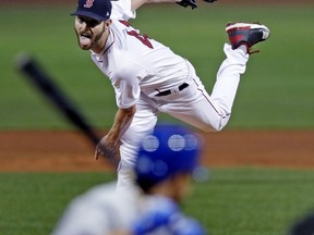 Boston Red Sox starting pitcher Chris Sale delivers during the first inning of a baseball game against the Toronto Blue Jays at Fenway Park in Boston, Tuesday, Sept. 11, 2018.