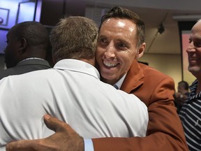 Steve Nash, a class of 2018 inductee into the Basketball Hall of Fame, hugs fans after a news conference at the Naismith Memorial Basketball Hall of Fame, Thursday, Sept. 6, 2018, in Springfield, Mass.