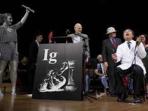 Akira Horiuchi, right, of Japan, who won the Ig Nobel in medical education demonstrates his self colonoscopy technic during award ceremonies at Harvard University in Cambridge, Mass., Thursday, Sept. 13, 2018.