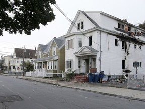 A damaged house on Bowdoin Street in Lawrence Mass., is seen Friday, Sept. 14, 2018. The home was one of multiple houses that went up in flames on Thursday afternoon after gas explosions and fires triggered by a problem with a gas line that feeds homes in several communities north of Boston