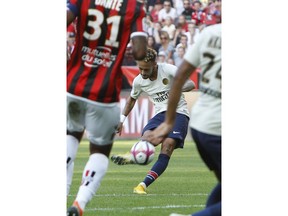 Paris Saint Germain's Neymar, scores his side's first goal, during the League One soccer match between Nice and Paris Saint-Germain at the Allianz Riviera stadium in Nice, southern France, Saturday, Sept. 29, 2018.
