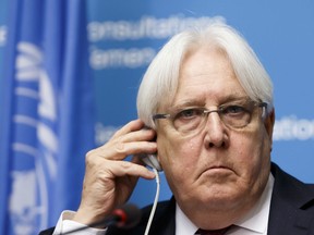 Martin Griffiths, UN Special Envoy for Yemen, adjusts his headset as he speaks to the media about Geneva Consultations on Yemen during a news conference, at the European headquarters of the United Nations in Geneva, Switzerland, Saturday, September 8, 2018.