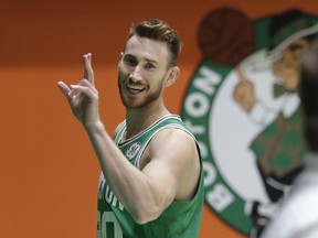 Boston Celtics' Gordon Hayward waves as he steps off the basketball court after speaking with members of the media and taking part in a photo shoot, Thursday, Sept. 13, 2018, at the team's practice facility, in Boston. Hayward is working his way back from a broken leg.