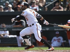Baltimore Orioles' Jonathan Villar follows through on an RBI-single against theChicago White Sox in the first inning of a baseball game, Sunday, Sept. 16, 2018, in Baltimore.