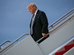 President Donald Trump walks down the steps after arriving on Air Force One, Friday, Aug. 31, 2018, at Andrews Air Force Base, Md.