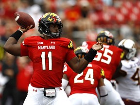 Maryland quarterback Kasim Hill throws to a receiver in the first half of an NCAA college football game against Minnesota, Saturday, Sept. 22, 2018, in College Park, Md.