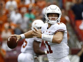 Texas quarterback Sam Ehlinger throws to a receiver during the first half of an NCAA college football game against Maryland, Saturday, Sept. 1, 2018, in Landover, Md.