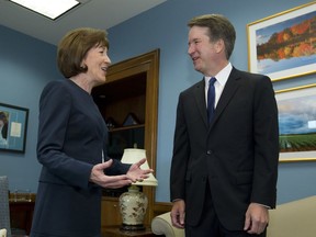 FILE- In this Tuesday, Aug. 21, 2018, file photo, Sen. Susan Collins, R-Maine, speaks with Supreme Court nominee Judge Brett Kavanaugh at her office, before a private meeting on Capitol Hill in Washington. The end of contentious confirmation hearings for U.S. Supreme Court nominee Kavanaugh is shifting the focus to potential swing votes like Republican Sen. Susan Collins of Maine.