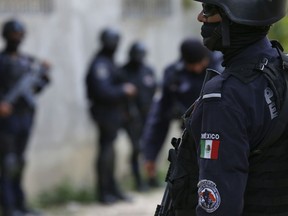 In this June 21, 2018 file photo, security forces patrol in Acapulco, Mexico.
